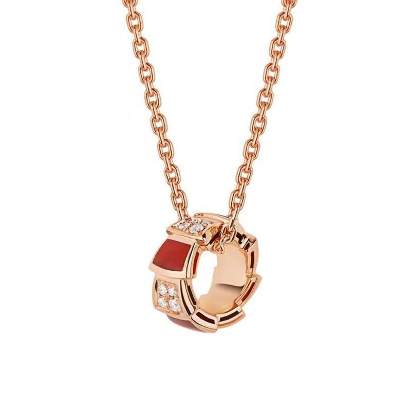 Gold and diamond white mother-of-pearl snake bone necklace